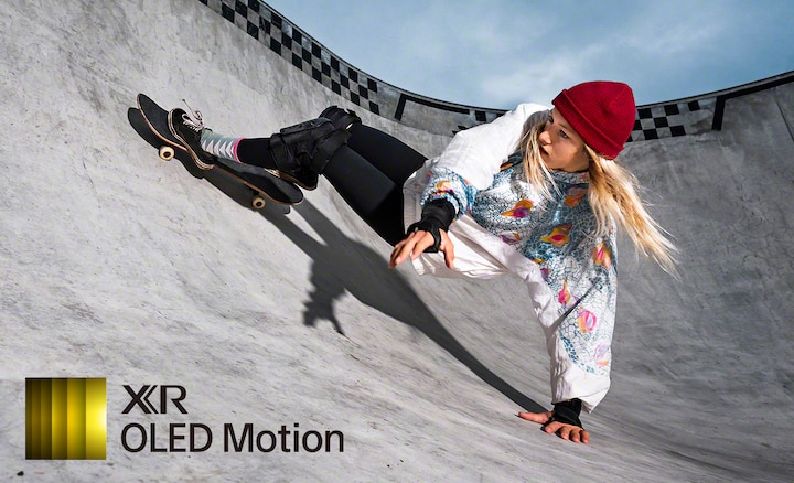 Image of woman on skateboard at skate park